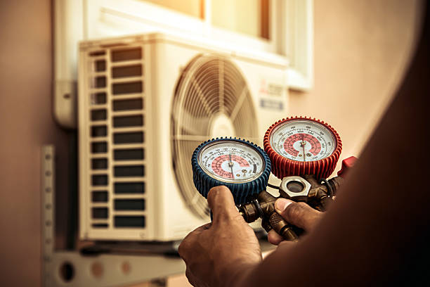 Professional Air Conditioning Service technician working in Bedminster, NJ